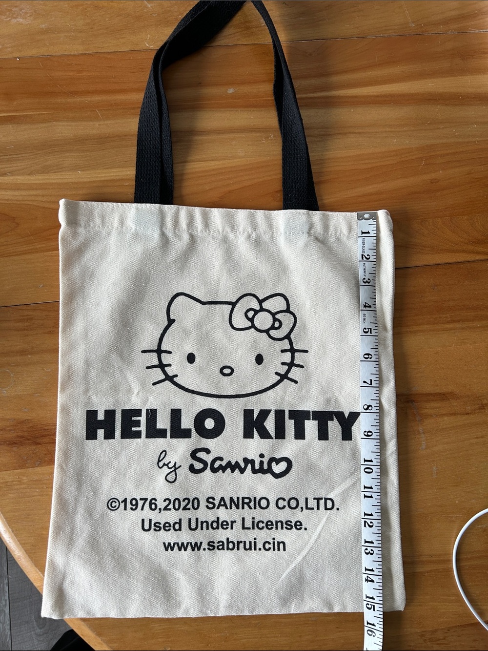 NWOT Sanrio Hello Kitty Cream Tote Bag with Black Print and Black Handles